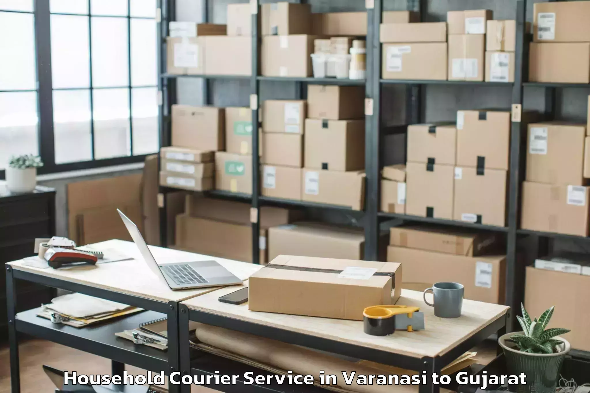 Get Varanasi to Hansot Household Courier